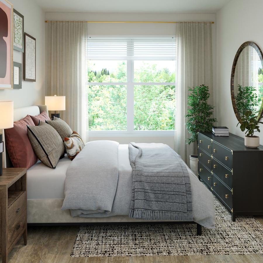 a bedroom with a bed and a mirror